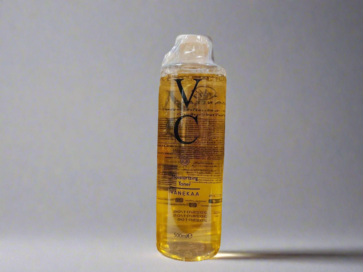 Bottle of VC skincare product on a gray background