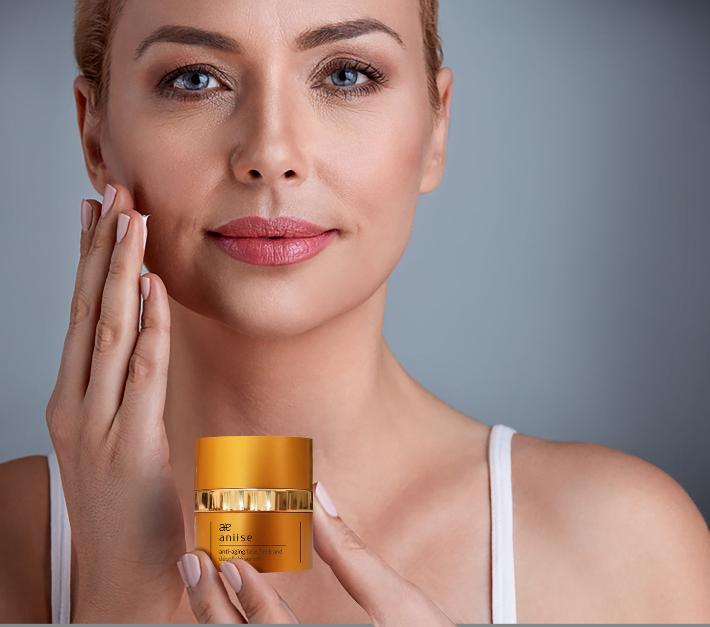 Woman holding a jar of skincare product with a neutral background